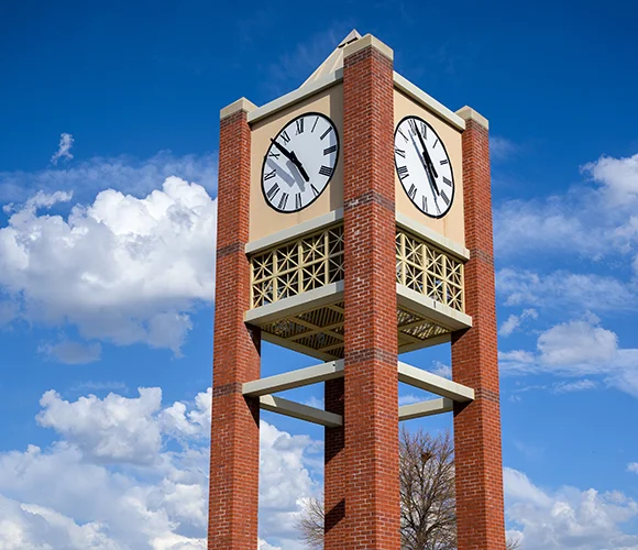 Clock tower with clouds behind