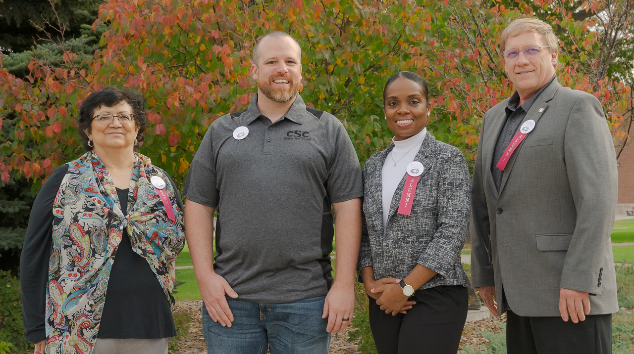 Shown are Distinguished Alumni Award recipients Dora Olivares, right, and Mark Brohman, left. In the center are two of the Distinguished Young Alumni Award recipients, Ryan Hieb and Nisha Durand.