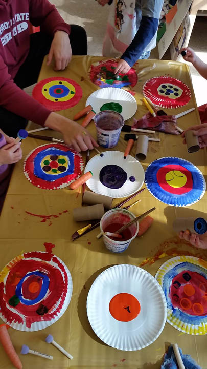 Painted paper plates on a table at the Child Development Center Laboratory
