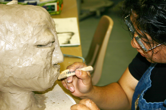 A student works on a sculpture project