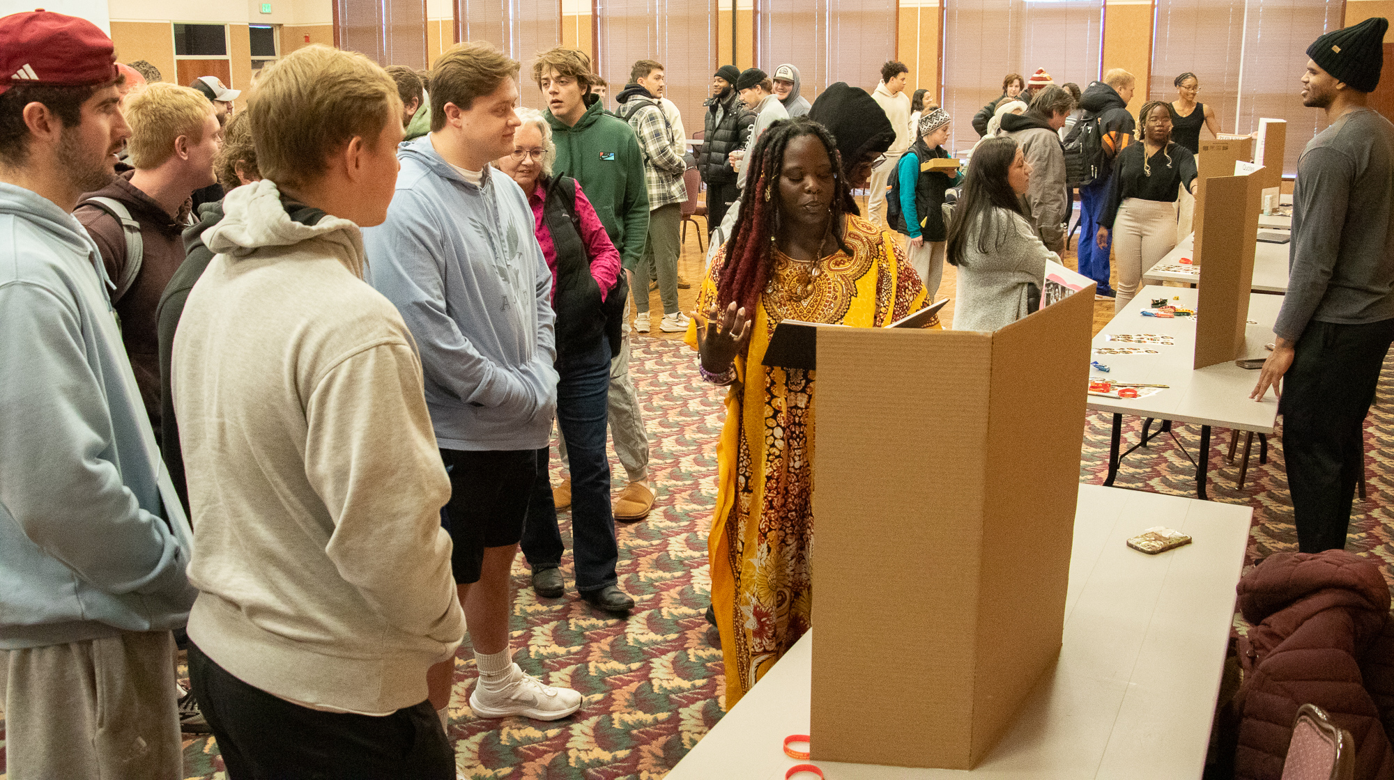 Sophia Oladimeji explains her poster at the CSC Black Excellence Expo