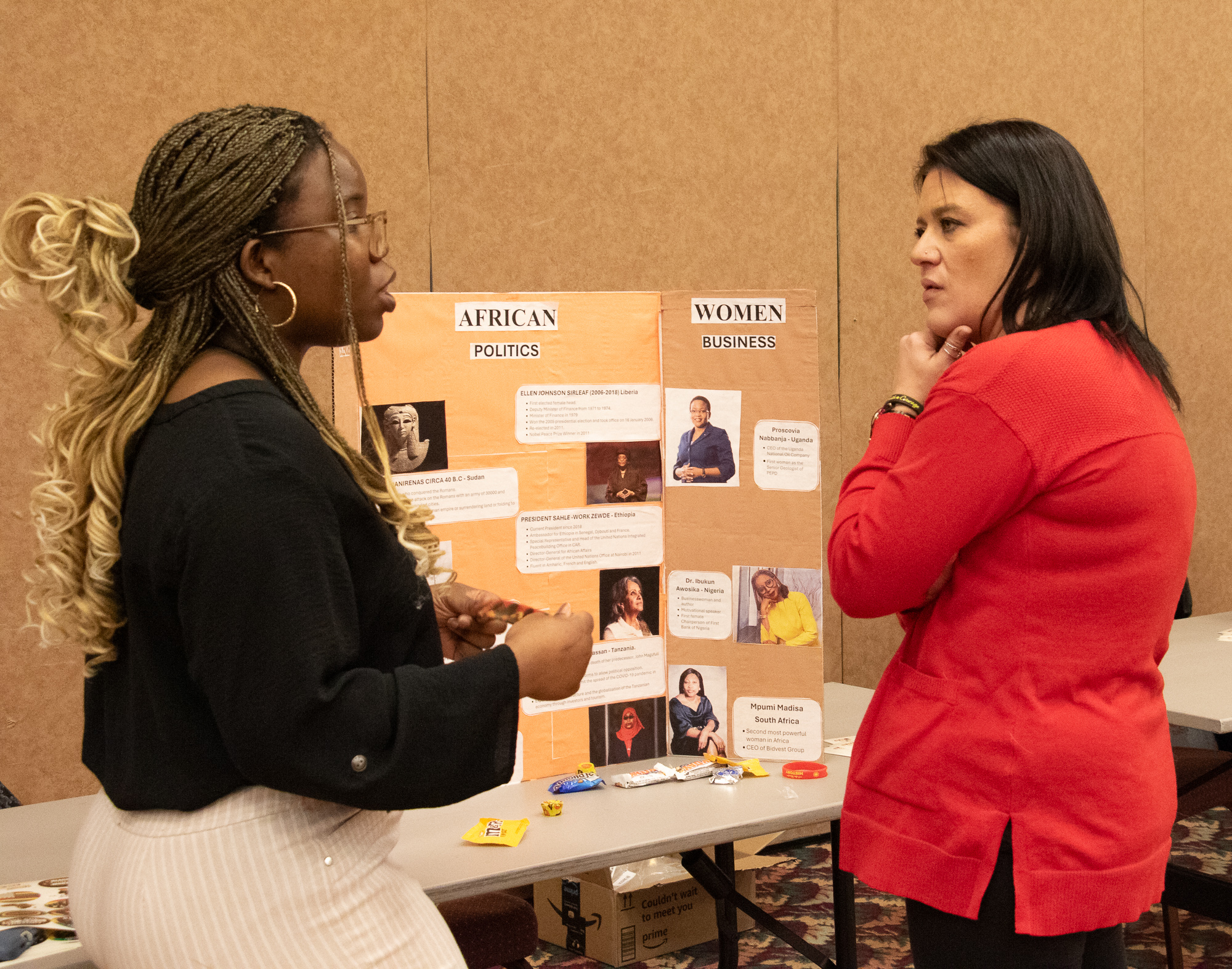 Emmanuella Tchona explains her poster at the CSC Black Excellence Expo