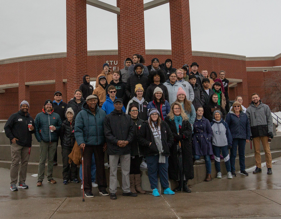 Community and campus participants in Chadron State College's MLK Day walk pose for a group photo at the Lindeken Clock Tower Jan. 16, 2023.