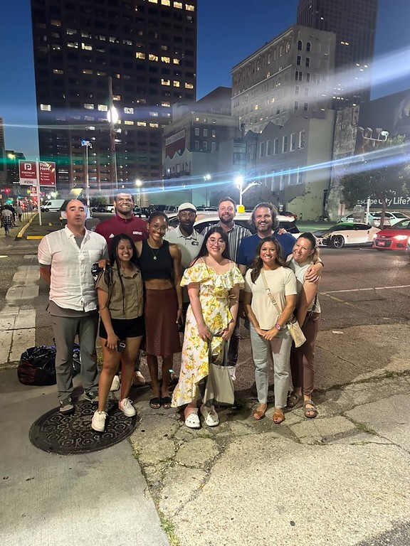 A majority of the Chadron State College contingent of students and employees pose for a picture in the French Quarter of New Orleans, Louisiana, June 2, 2023. Back row, from left, Markus Jones, Porter Anderson, Ted Tewahade, Taylor Osmotherly, and Alex Helmbrecht. Front, Ruhama Molla, Aiyana Fujiyama, Kayla Campos, Jennifer Stadler, and Britt Helmbrecht. Not pictured: Haesong Kwon.