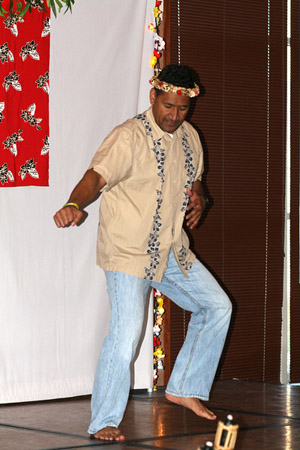 Ottley Wright, academic advisor for Chadron State College's Extended Campus Programs, performs a dance during the annual Aloha Dinner