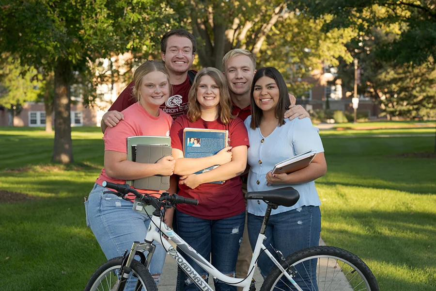 Five students with books