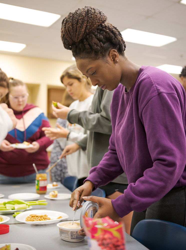 Students work on a snack project in the Burkhiser Complex