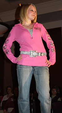 Student posing during a fashion show