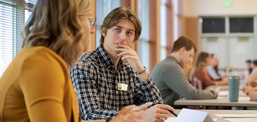 A student listens during an event featuring business leaders