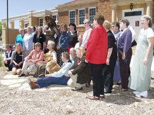 The editors and authors of Crazy Woman Creek gather around the statue of Mari Sandoz for photos.