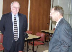 Two men discuss the North Platte Canteen