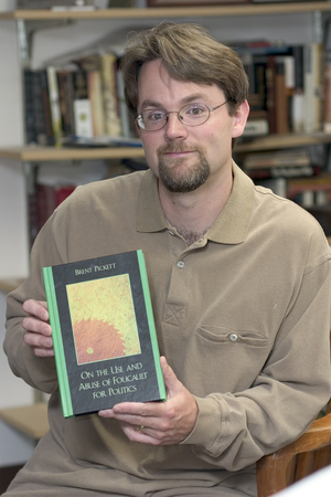 Dr. Brent Pickett with his new book, On the Use and Abuse of Foucault for Politics.