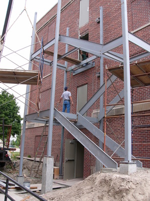 Workers for All Metal Construction at Rapid City put up the steel for the fire escape in Edna.