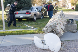 Chadron Police Officer Brent Beekman and members of the Chadron Volunteer Fire Department work at the accident scene.