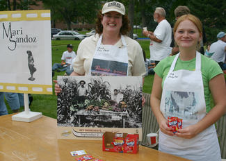 Sarah Polak and assistant Carly Peterson promote the upcoming exhibit at Tastes of Chadron.