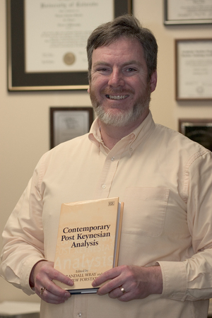 Dr. Thomas Swanke with the new book.