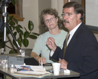 Dr. Ken Emonds describes the electrodermal titration process as he performs it on volunteer Sherrie Emerson.