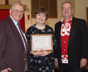 Cynthia Parish Sabah stands between Dr. William Winkle and Dr. Sandy Schaefer,