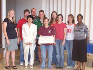 Many of Chadron State's peer tutors join Frances Gonzalez, tutor coordinator, to celebrate the program's recertification.