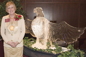 Janie Park poses with ice sculpture of an eagle.