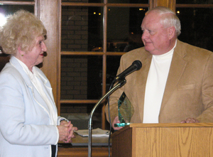 Sybil Berndt accepts the Spirit of Mari Sandoz Award from David Sandoz.