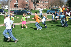 Children race for the goods during the Easter egg hunt.