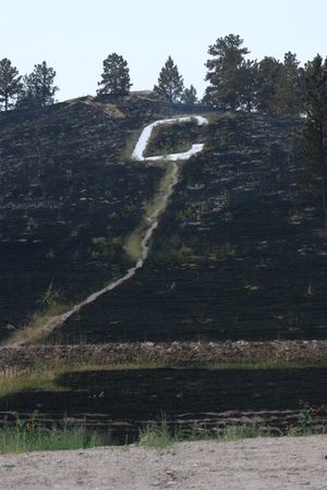 Chadron's C-Hill stands blackened from this week's wildfires.