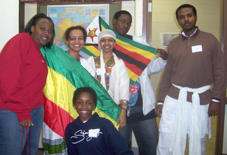 Members of the International students pose with high school students.