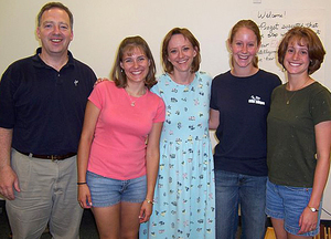 Jim Margetts and three CSC students are shown with Autumn Woods Keller.