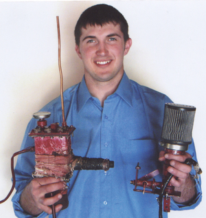 Ben Morse holds the parts to the Vapster that he built this spring.