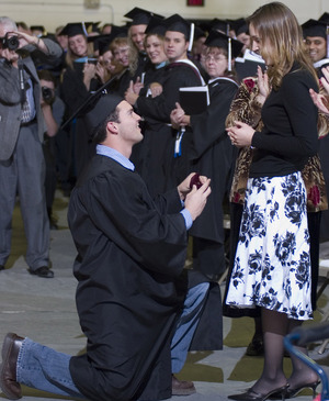 Michael Schumacher proposes to Lauren Hiers at the close of Friday's graduation ceremony.