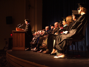 The inauguration ceremony's speakers listen as Dr. Janie Park delivers her address.