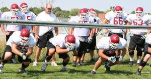 Head Coach Bill O'Boyle directing the session, Chadron State College offensive linemen