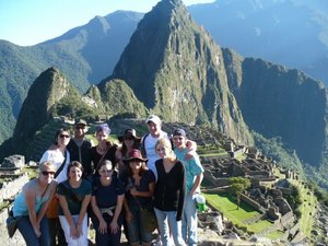 Chadron State College students pose in front of some of the Incan ruins they visited this summer. In the background is Wayna Picchu, an Andes peak that most of the students climbed.