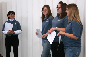 CSC tutor students are awarded and speak to a crowd.