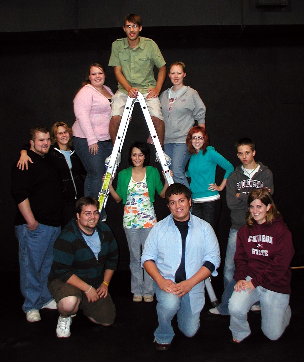 Students pose around ladder