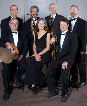 Music faculty pose with their instruments