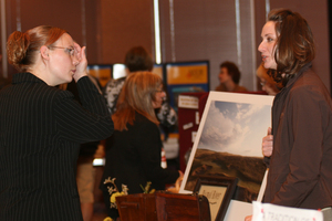 Two students speak at a job fair