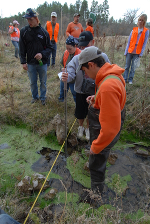 Students measure water levels