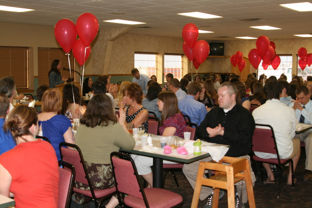 Banquet attendees listen as Health Professions Club president Tiffany Keiser conducts the event.