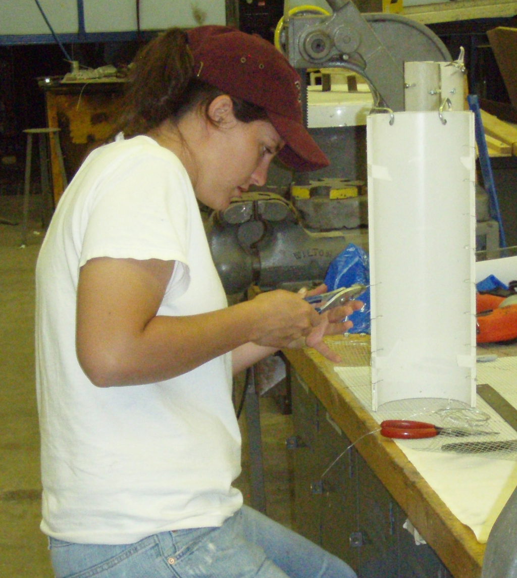 Chadron State College junior Shelley Miller of Minatare constructs turfgrass evaluation tubes in the Burkhiser Complex's design technology and education shops.