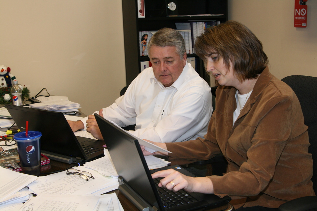 Dale Williamson and Joby Collins prepare for April's registration.