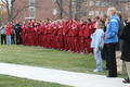 Attendees watch as the flag is raised