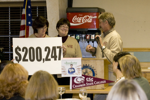 Three ladies announce how much money was raised