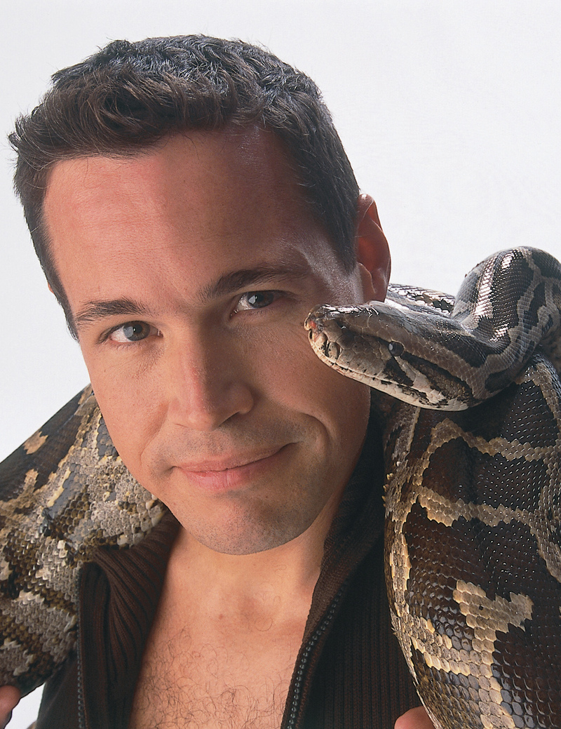 Jeff Corwin with a snake on his shoulders.