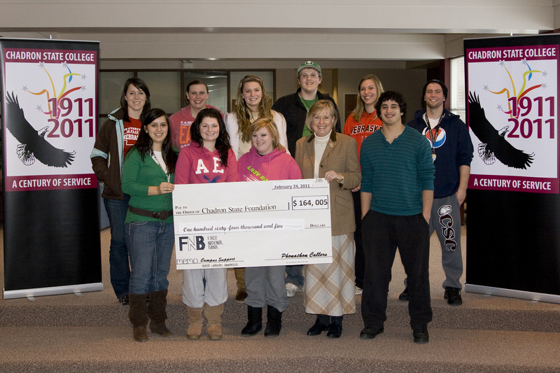 Student callers of the Chadron State Foundation Phonathon gather with Dr. Janie Park, CSC president.