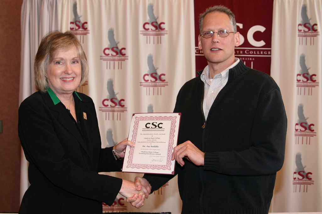 President Janie Park presents the Chadron State College Teaching Excellence Award to Jay Sutliffe.