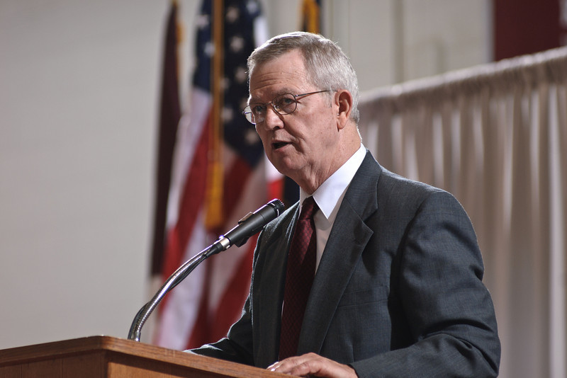 Larry Miller makes a point during his speech for Chadron State College's undergraduate commencement ceremony.