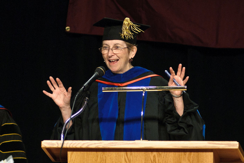 Dr. Norma Nealeigh speaks during Chadron State College's ceremony for master's degree recipients.