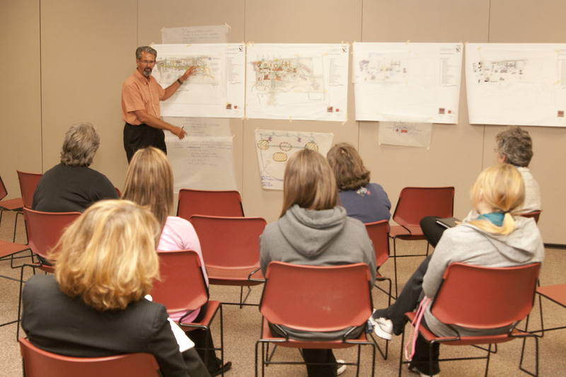 Chadron State College students and employees listen to a presentation of master plan ideas by Dan Spiry.